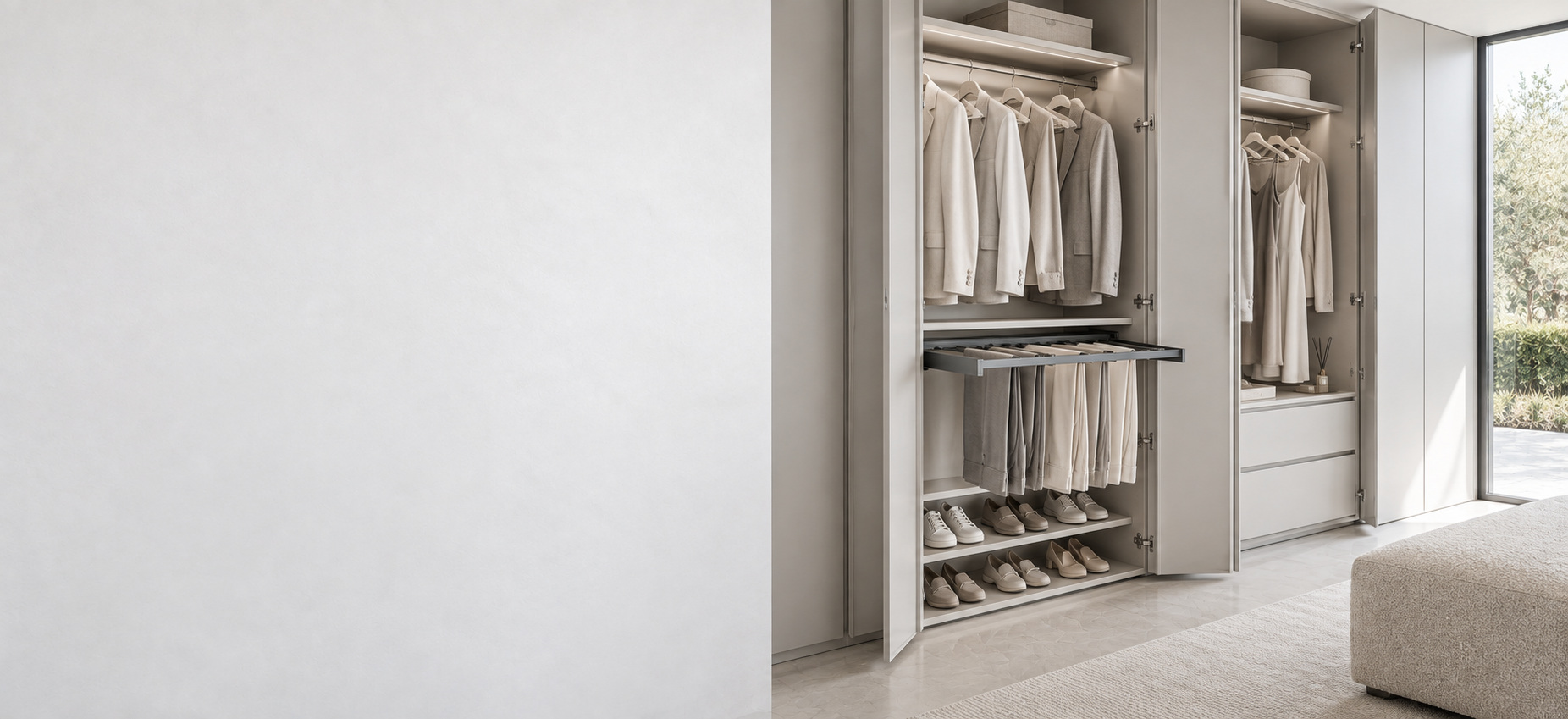 Refined wardrobe interior with hanging rails, pull-out trouser storage and shoe shelving.